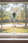 Large beaded spider with crystal sun catcher ball.